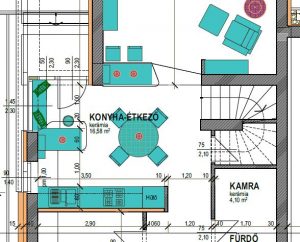 A colored architectural plan details a kitchen and dining area from above. Turquoise counters and fixtures form an L-shaped work zone around a central round table. Dimension lines, room labels, chairs, and adjoining spaces appear around the plan.