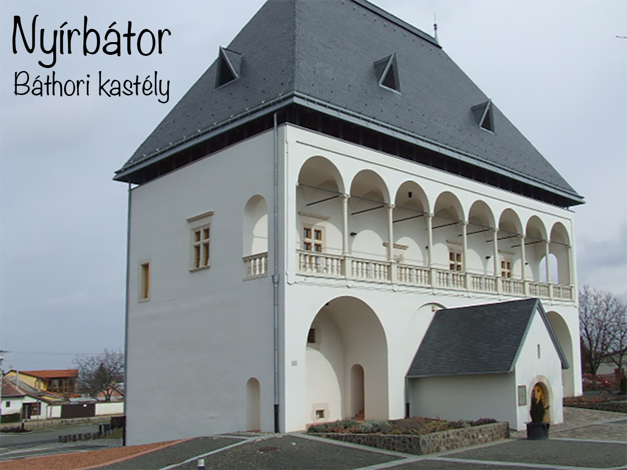 White Báthori Castle in Nyírbátor with a two-level arched arcade.