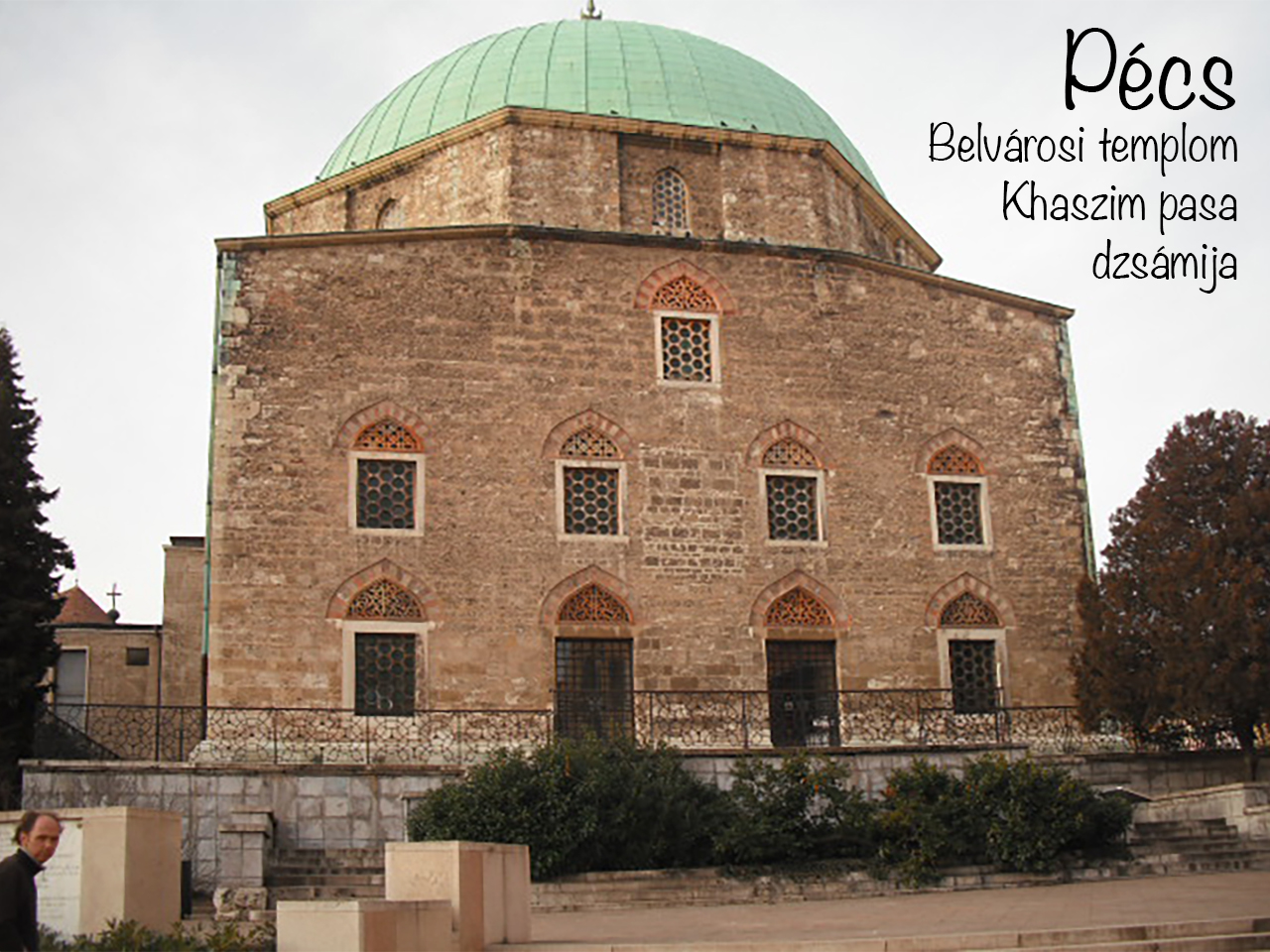 Green-domed stone facade of the Khaszim pasa mosque in central Pécs.
