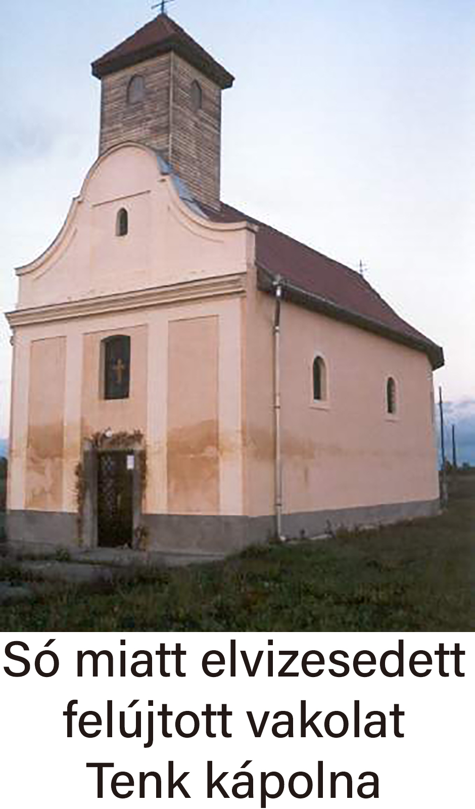 Pink chapel with damp-stained lower facade and brick bell tower