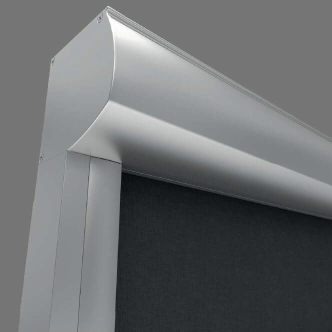 A close-up shows the upper corner of a silver-colored metal frame around dark mesh. A horizontal rounded housing extends from the corner toward the right, above a vertical side rail. Several small fasteners are visible on the pale gray end plate and frame.