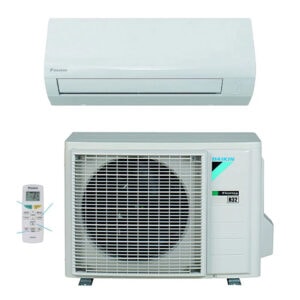 A white Daikin indoor unit is shown above a matching square outdoor condenser. A small remote control is placed to the left, and blue-green branding appears on the condenser. The product set is isolated on white with the outdoor fan grille facing forward.