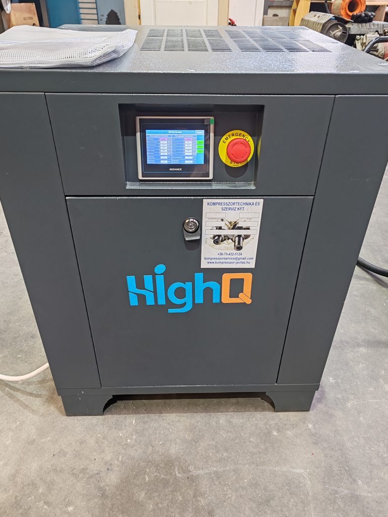 HighQ compressor cabinet with control screen and emergency stop button.