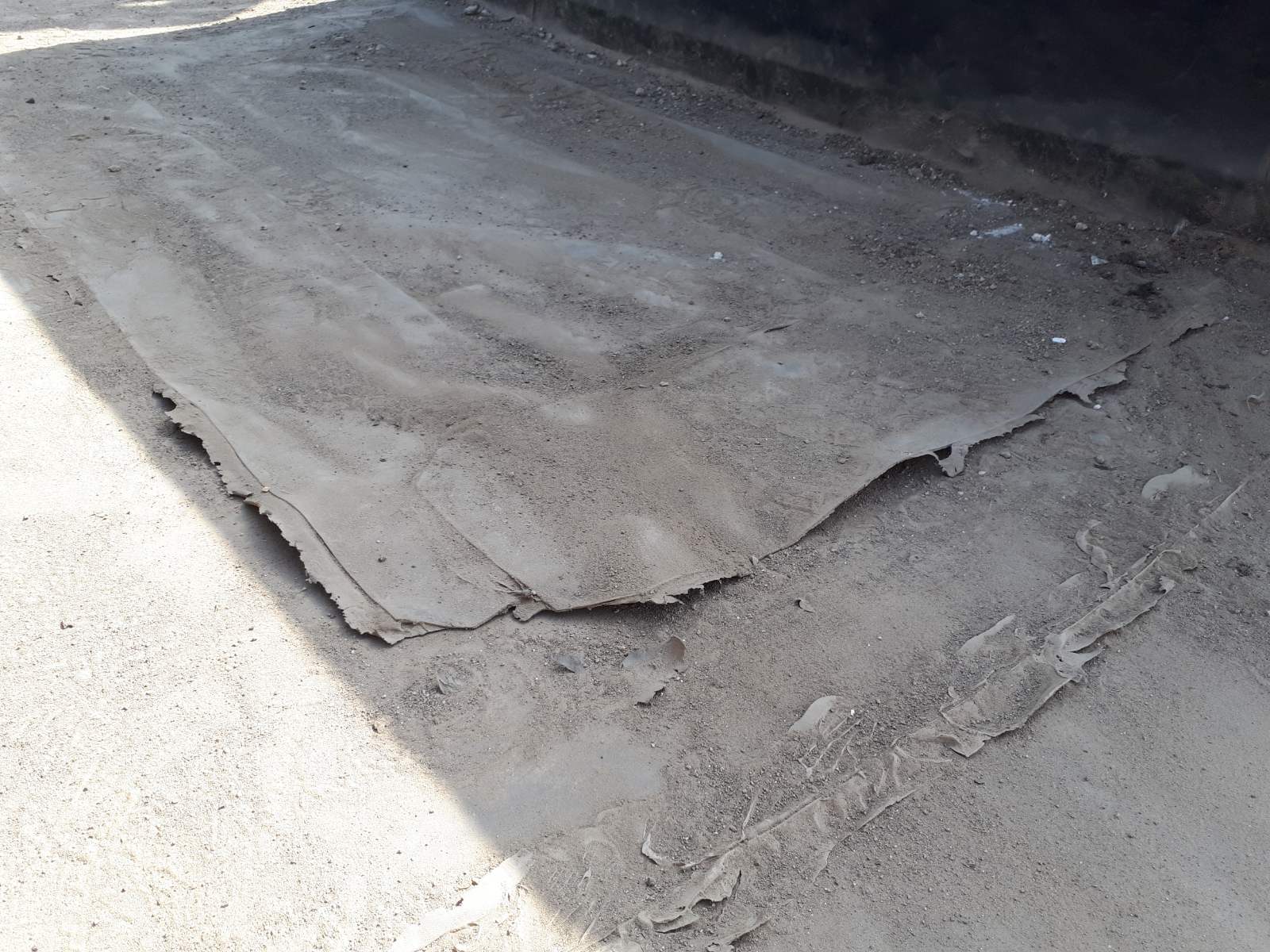 Flat roof waterproofing work viewed from above.