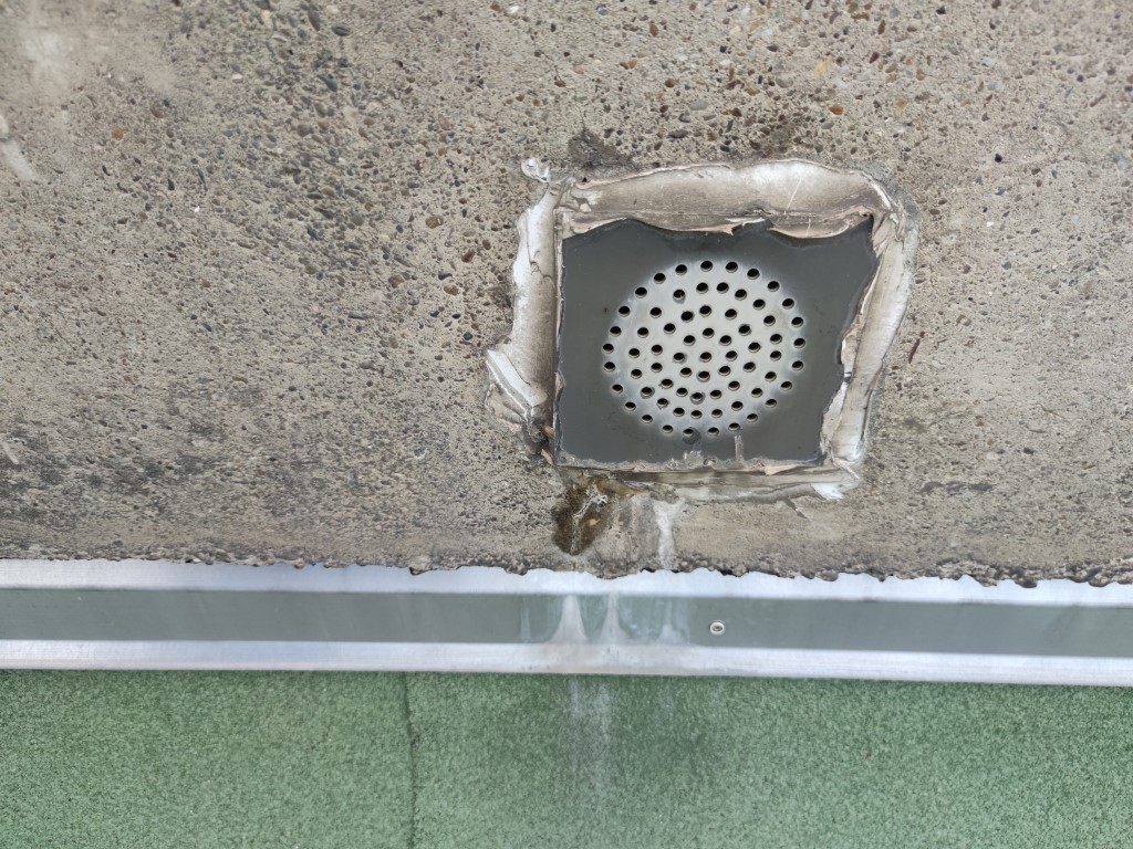 Flat roof waterproofing work viewed from above.