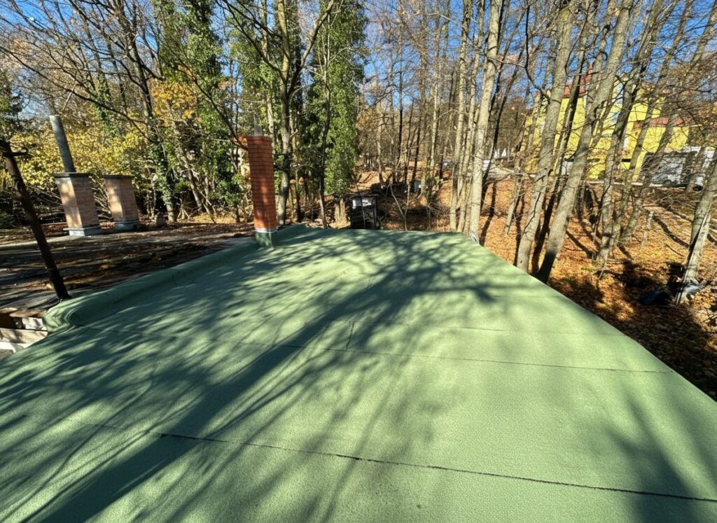 Flat roof waterproofing work viewed from above.