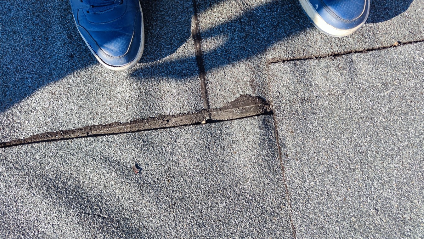 Flat roof waterproofing work viewed from above.