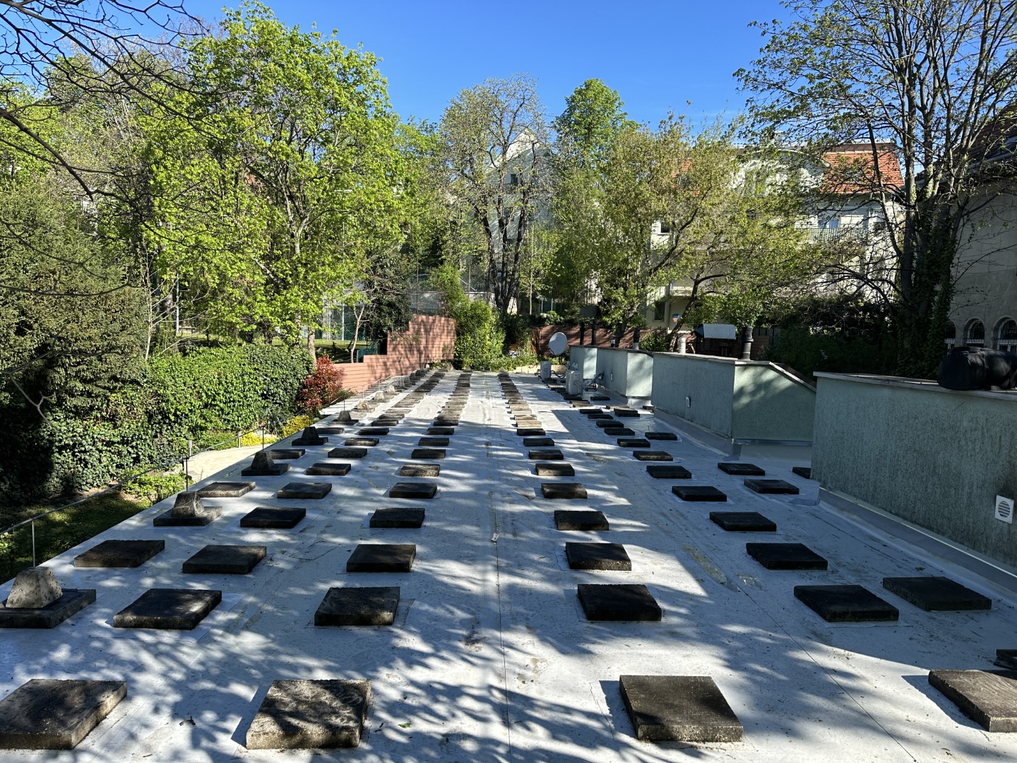 Flat roof waterproofing work viewed from above.