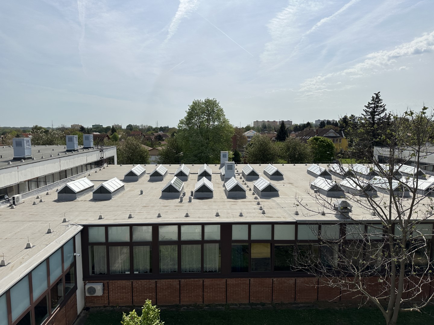 Flat roof waterproofing work viewed from above.