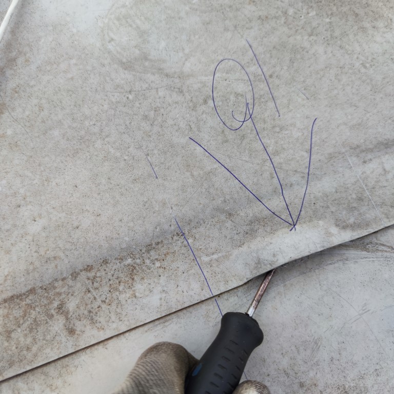 Flat roof waterproofing work viewed from above.
