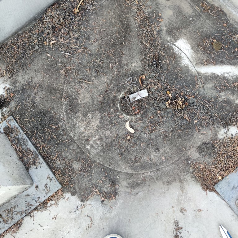 Flat roof waterproofing work viewed from above.