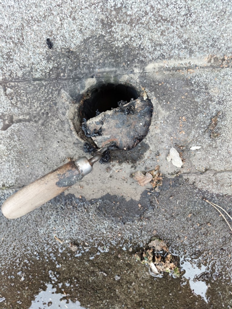 Flat roof waterproofing work viewed from above.