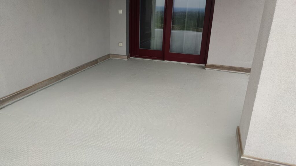 Flat roof waterproofing work viewed from above.