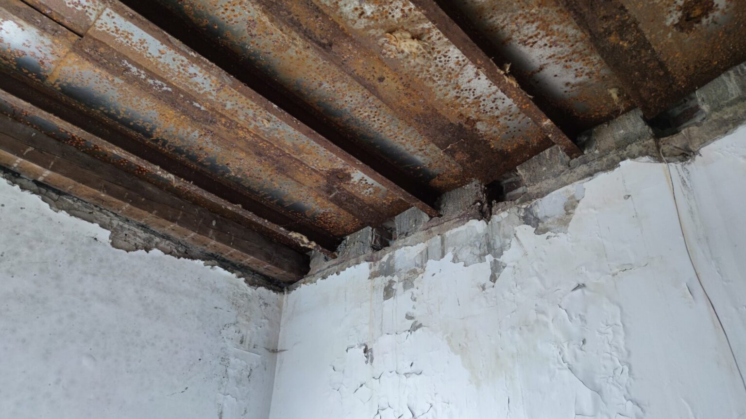 Flat roof waterproofing work viewed from above.