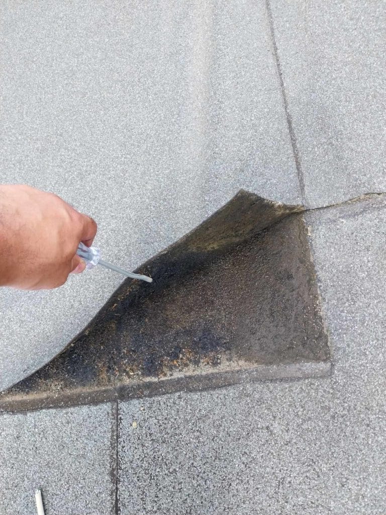 Flat roof waterproofing work viewed from above.