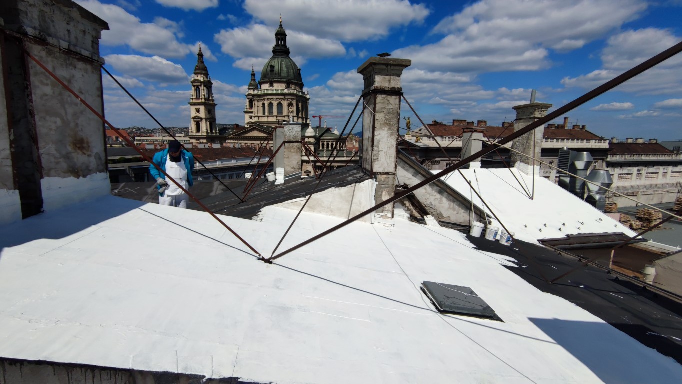 Flat roof waterproofing work viewed from above.