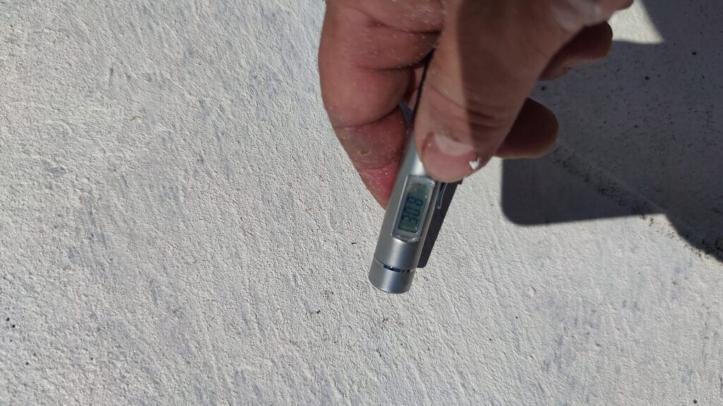 Flat roof waterproofing work viewed from above.