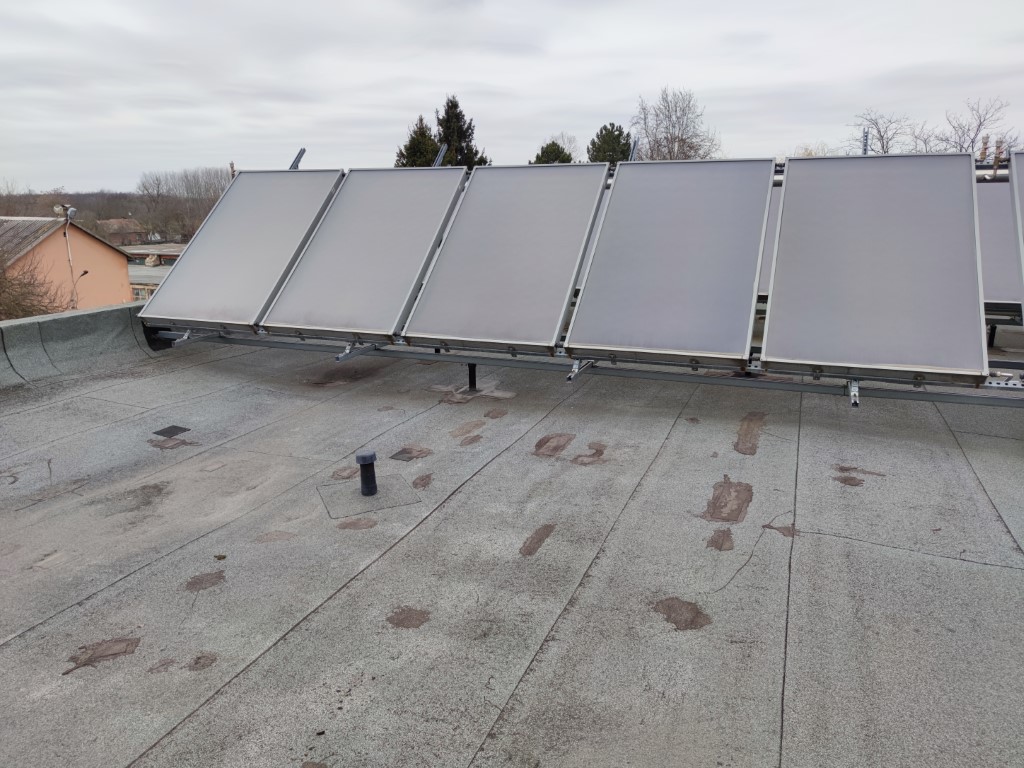 Flat roof waterproofing work viewed from above.