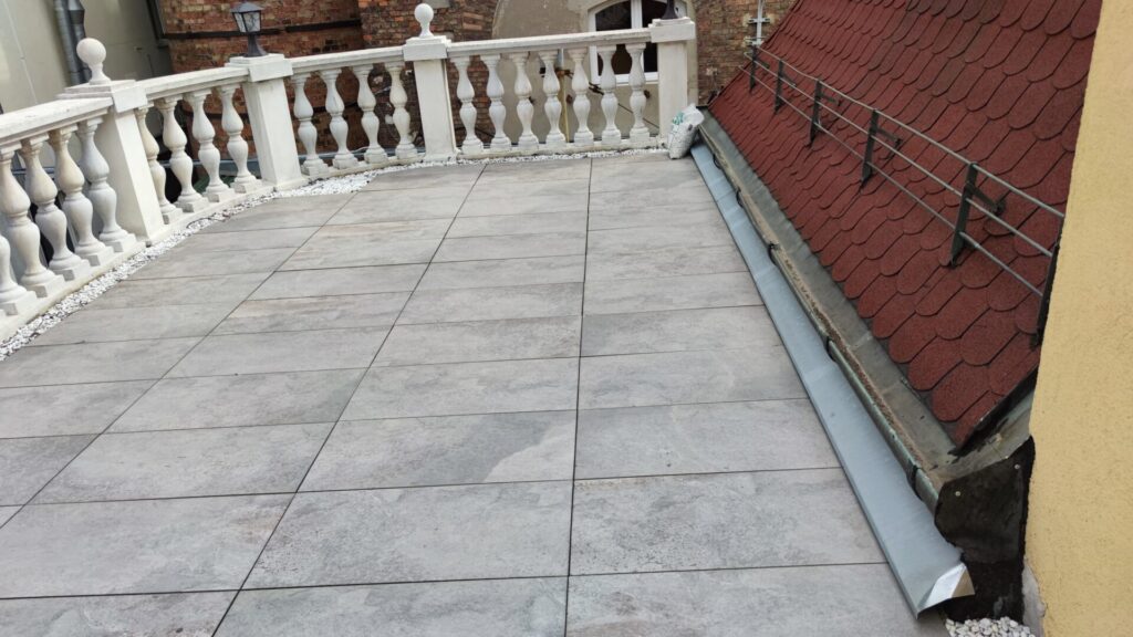 Flat roof waterproofing work viewed from above.