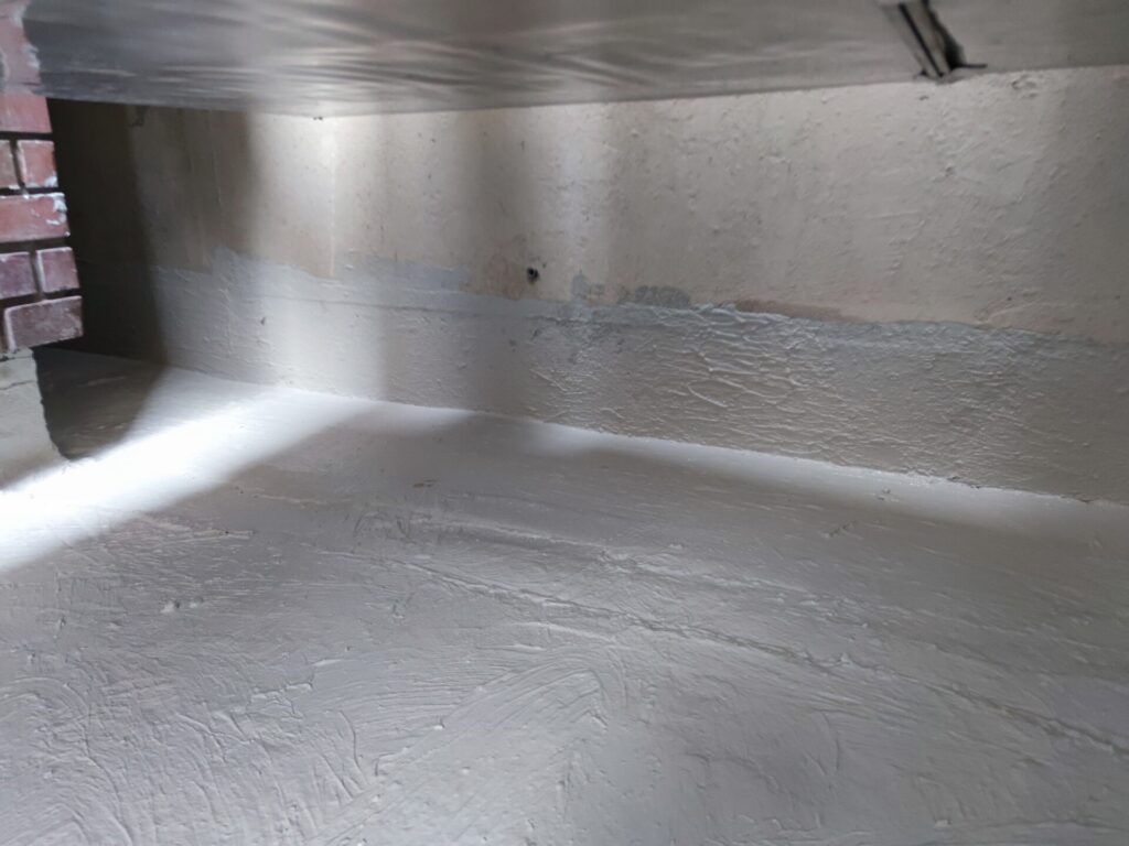 Flat roof waterproofing work viewed from above.