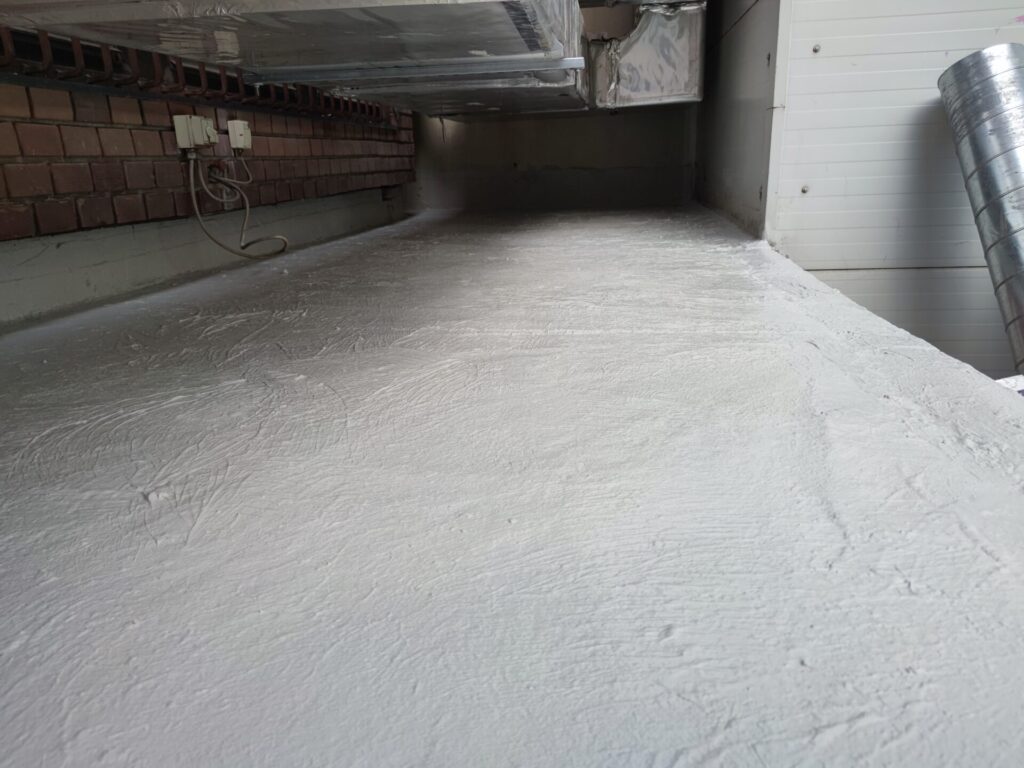 Flat roof waterproofing work viewed from above.