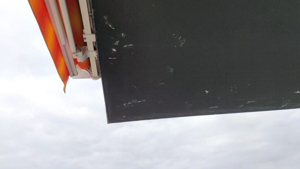 Flat roof waterproofing work viewed from above.