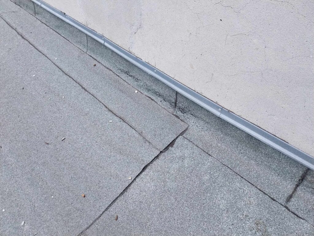 Flat roof waterproofing work viewed from above.