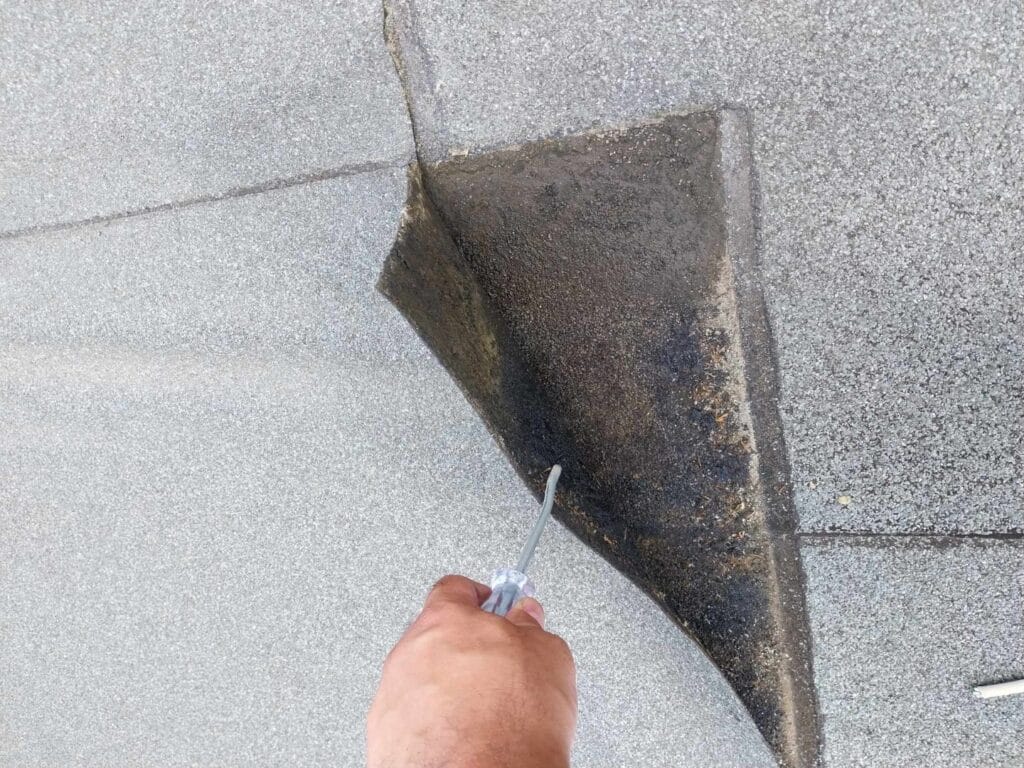 Flat roof waterproofing work viewed from above.