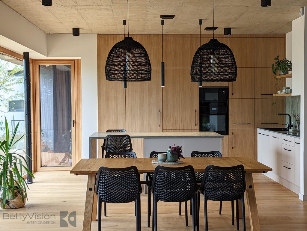 Bright kitchen-dining room with pendant lights.