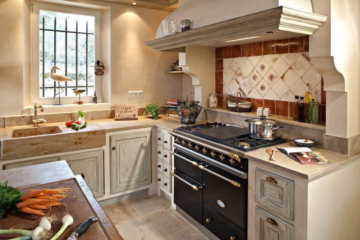 Cream kitchen with pale green lower cabinets.