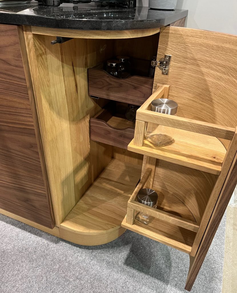 Tall pull-out cabinet with narrow shelves.