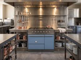 Dark kitchen with black hood and island.