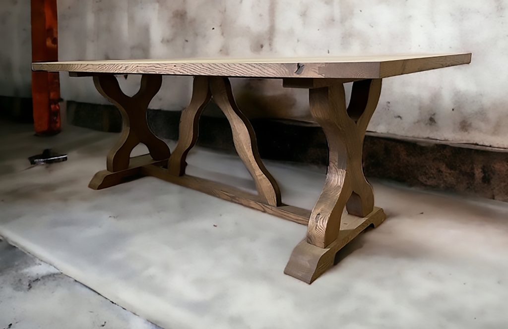 Dark table with curved pedestal bases.