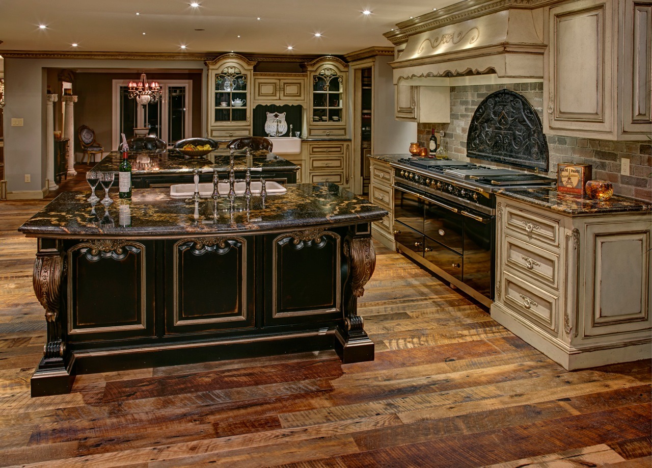 Gray kitchen with glossy backsplash.