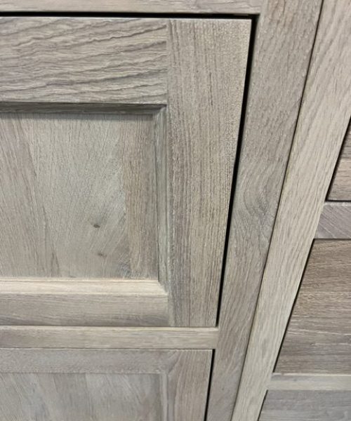 Gray wood-grain panel with white trim.