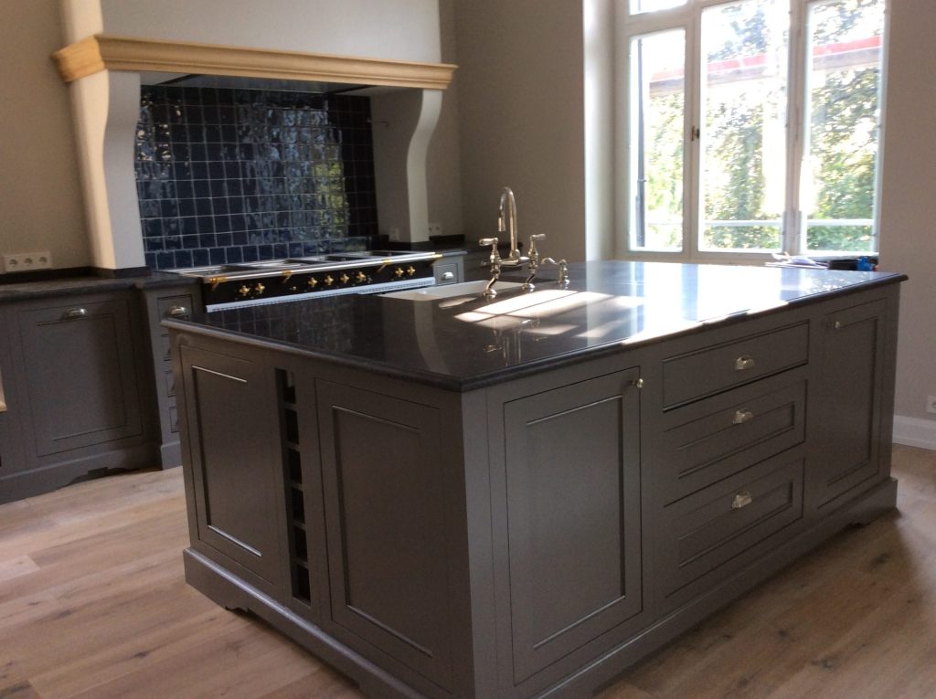 Kitchen photo with blue architectural overlay.
