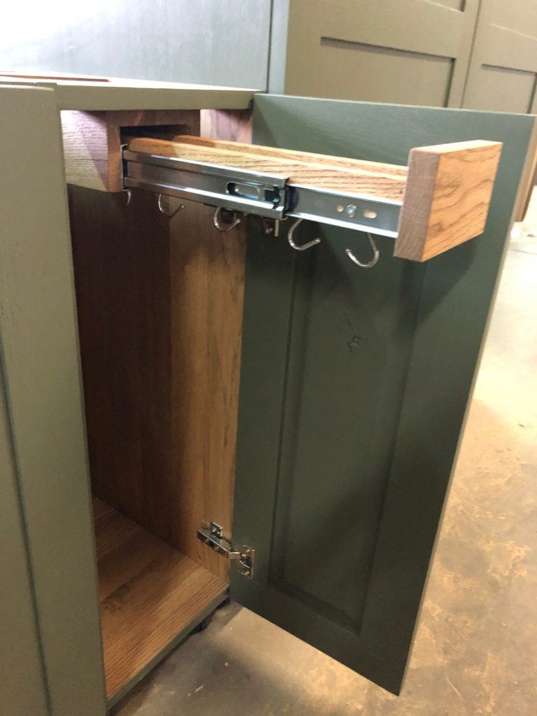 Wood drawer with visible metal mechanism.