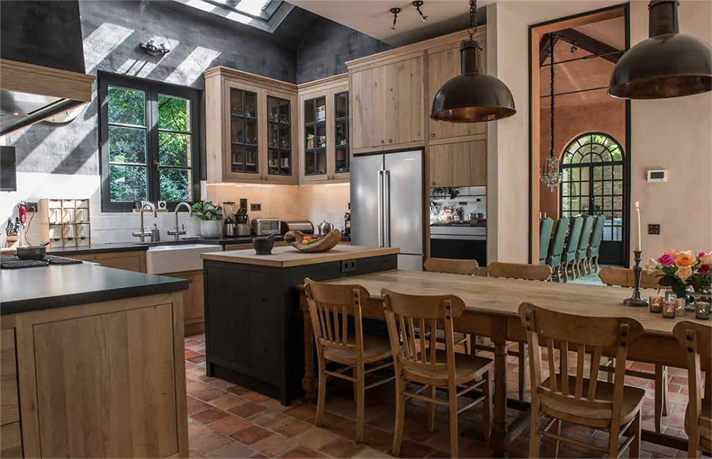 Wood-and-black kitchen with dining table.