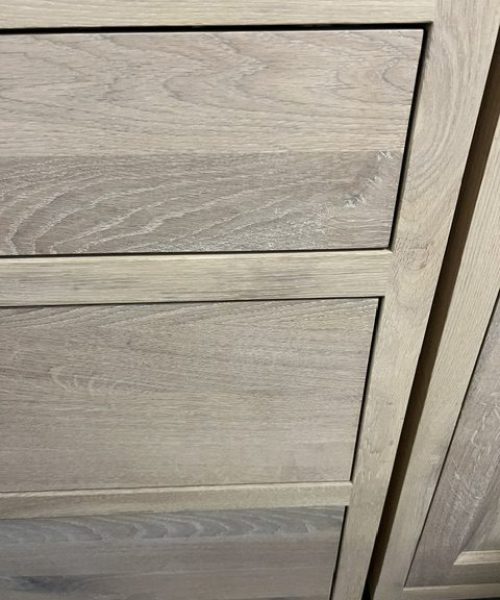 Pale wood-grain cabinet panels.