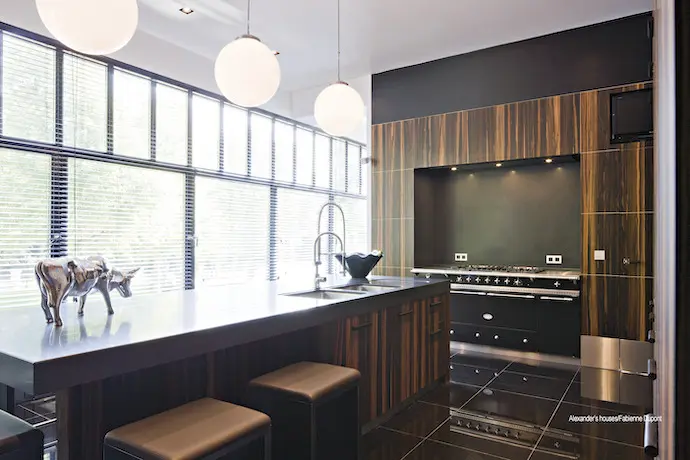 Stainless cooking wall with hanging pans.