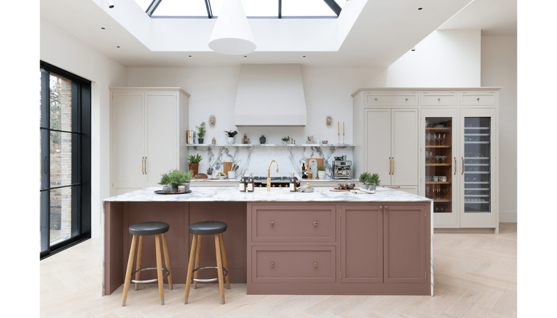 Warm beige kitchen with patterned backsplash.