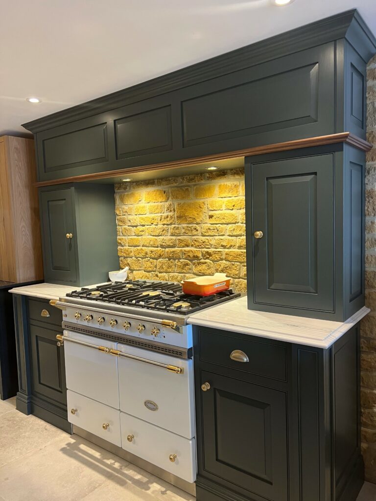 Warm wood kitchen with island and beams.