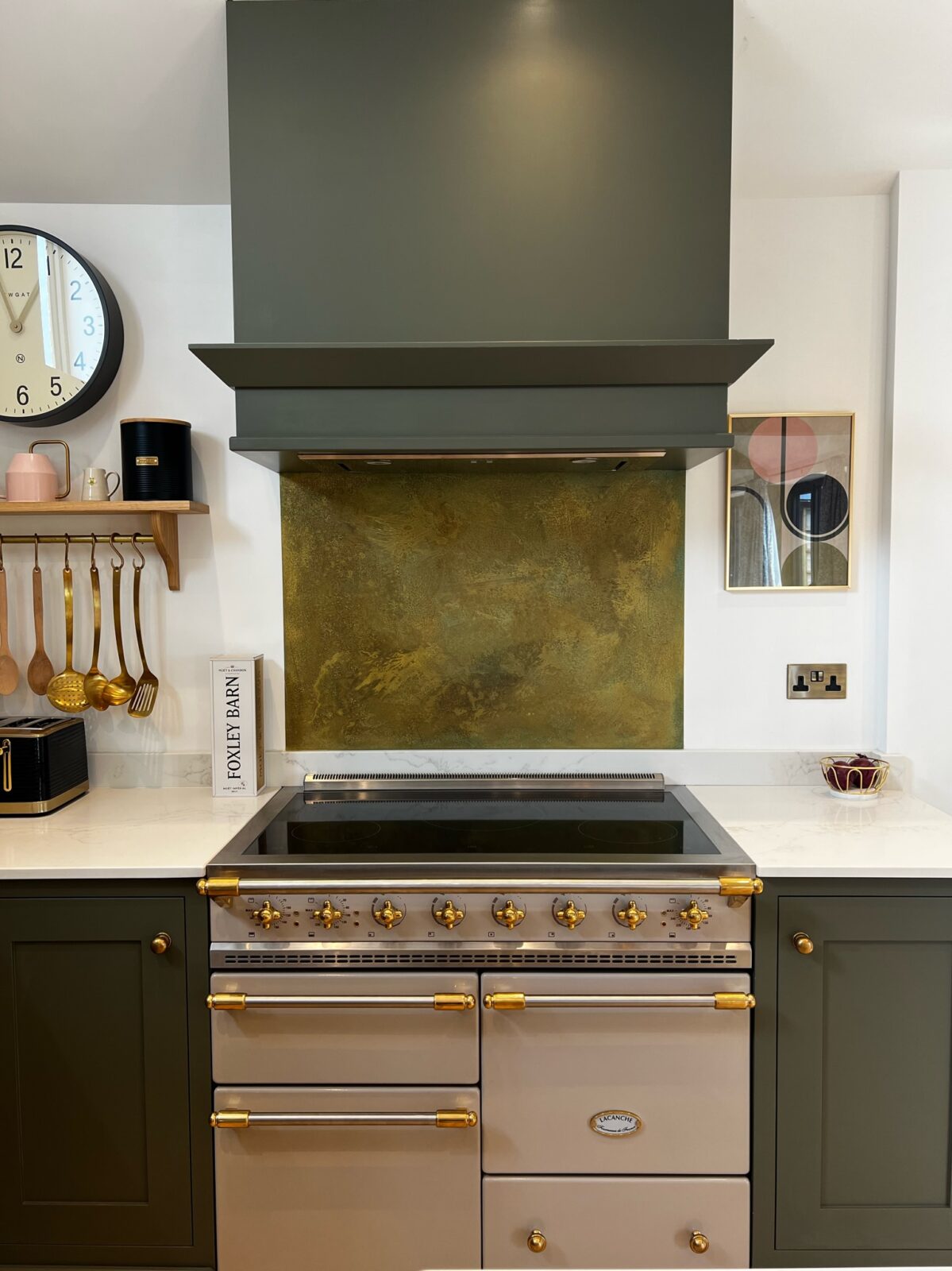 White inset kitchen with patterned backsplash.