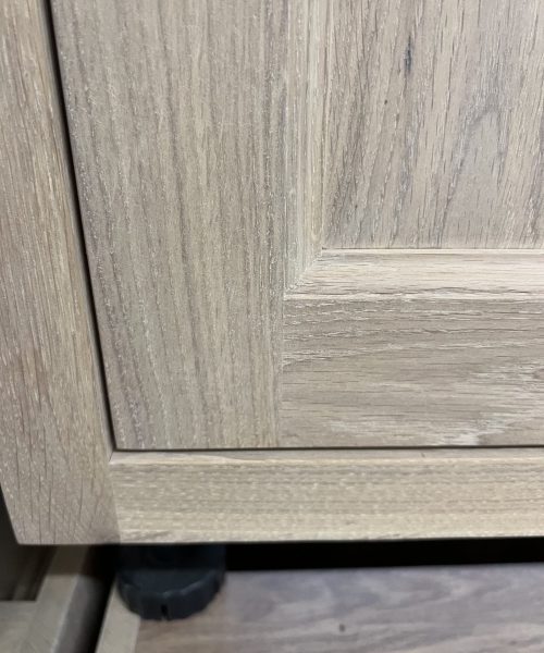 Wood-grain drawer fronts with dark outlines.