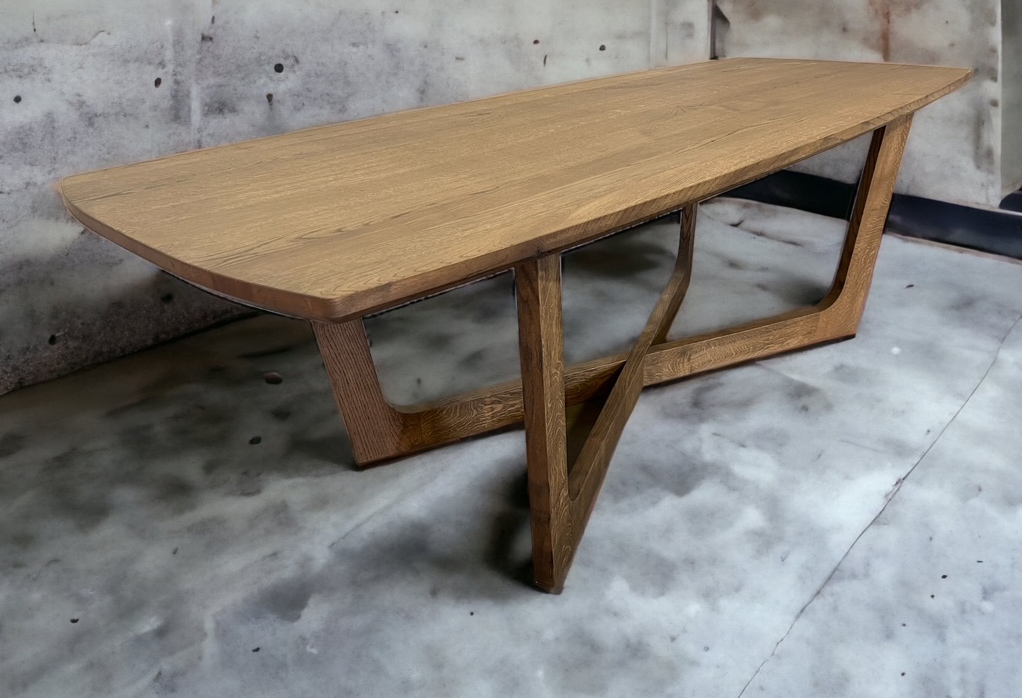 Wood table with angular crossed supports and visible end grain.